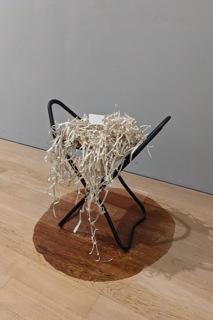 the book sculpture on a chair